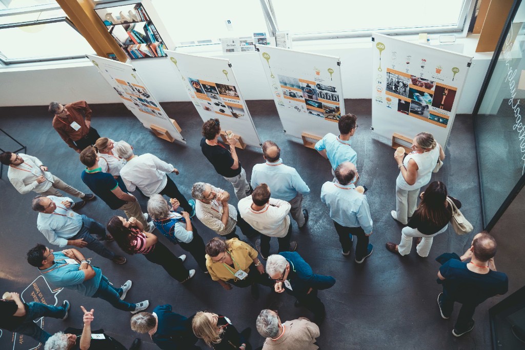Guests reading the history boards laid out on the floor.