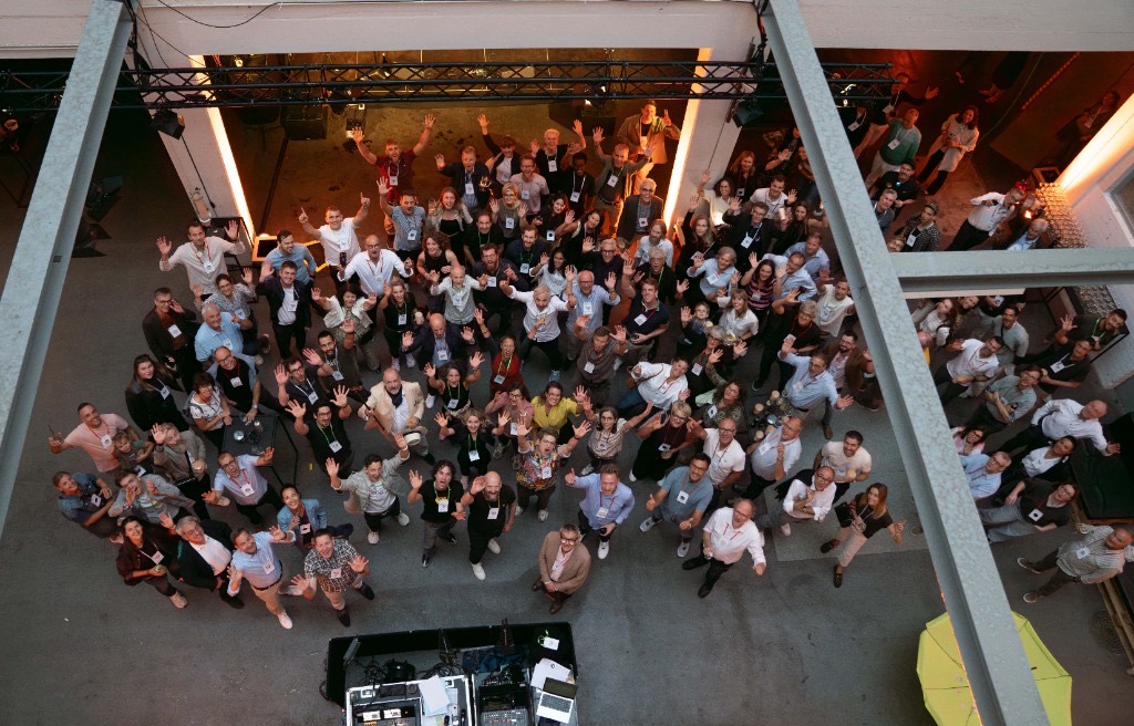 Guests gathered for Creaholic's 40th anniversary, waving from the floor of the Biel workshop.
