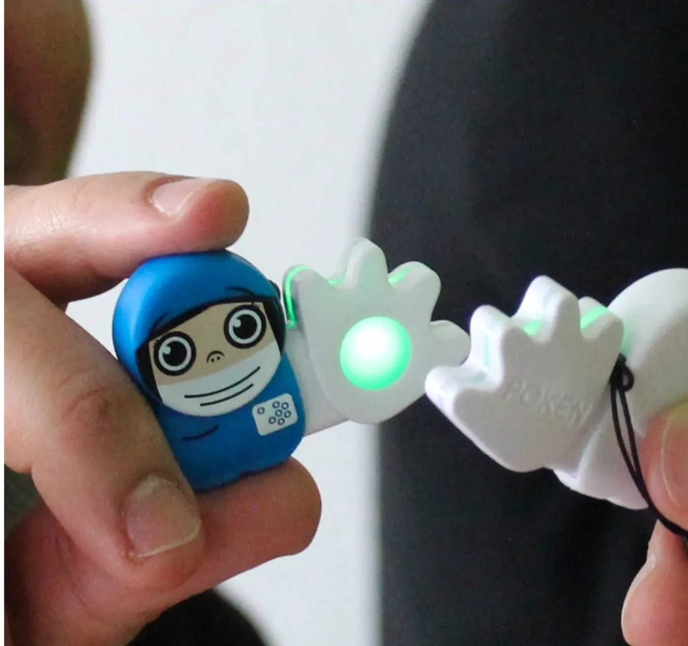 Two Poken devices being touched together