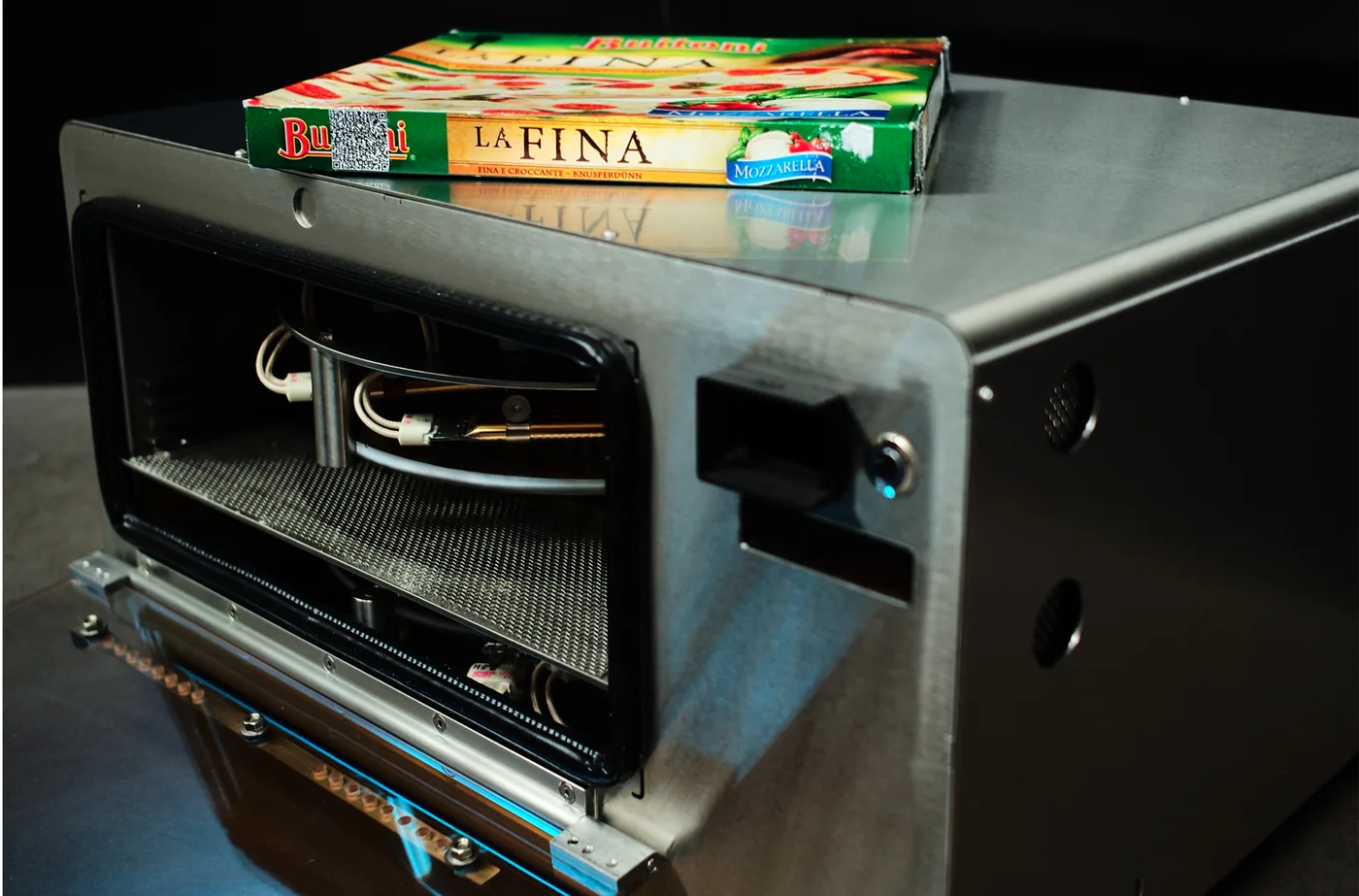 A portable halogen convection cooker under test