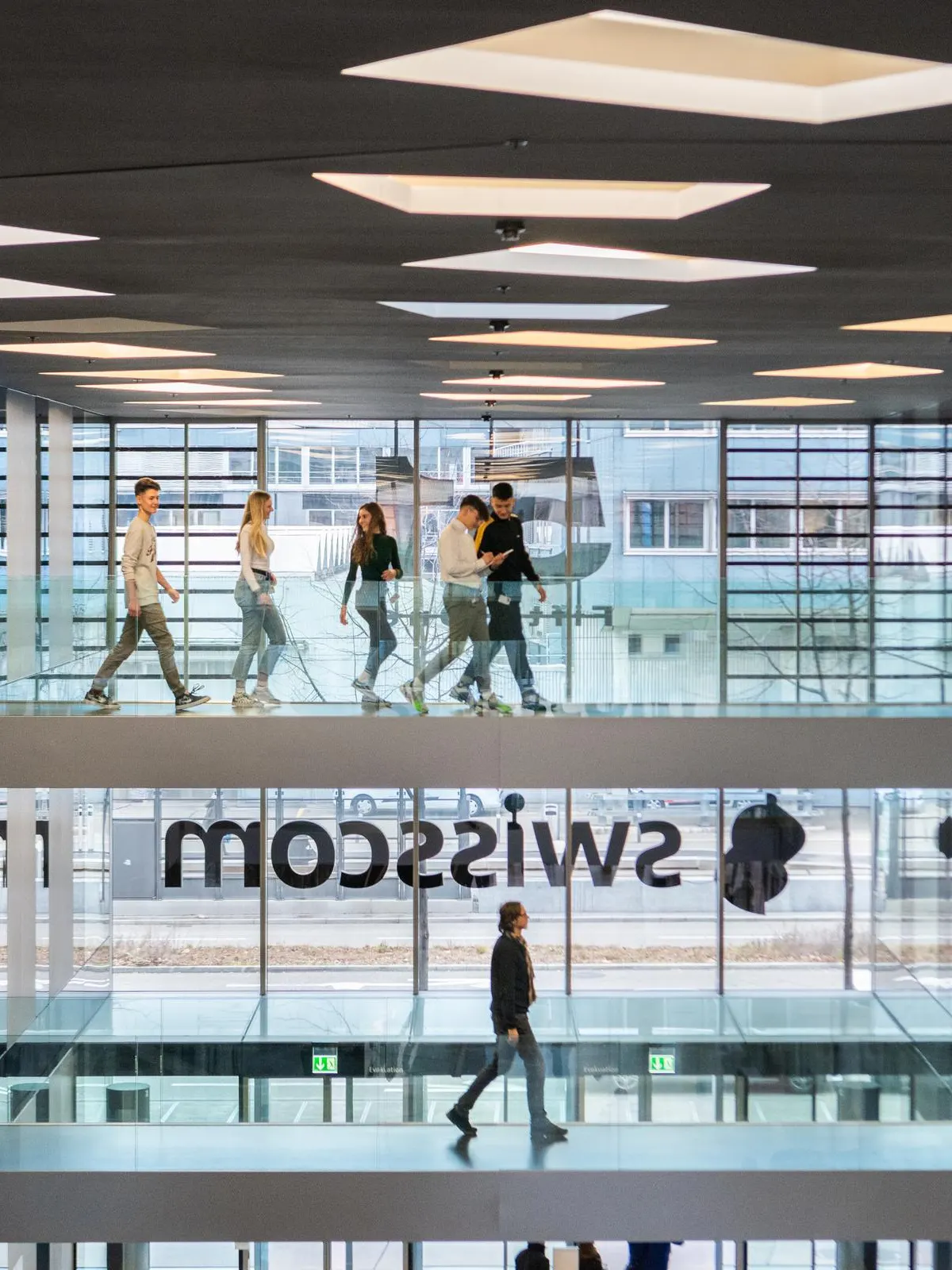 People walking in Swisscom office