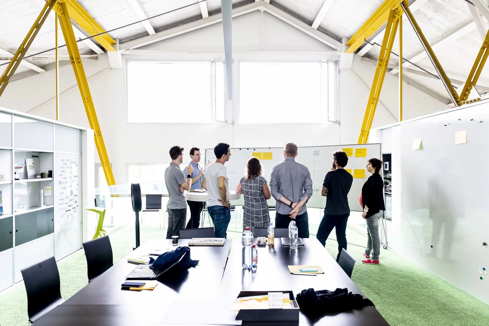 A Creaholic workshop: a team around the boards, figuring out whether it makes business sense